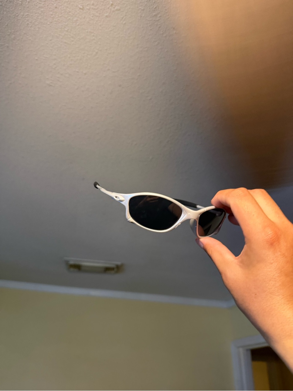 White Frame Oval Sunglasses with Black Lenses Oakley Oakleys